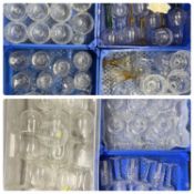 LARGE COLLECTION OF CUT GLASSWARE including champagne flutes, sundae dishes and brandy balloons,