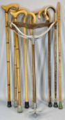 EIGHT VINTAGE WALKING STICKS & AN ALUMINIUM AND LEATHER SHOOTING STICK, natural woods with curved or