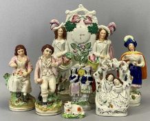 19TH CENTURY STAFFORDSHIRE FLATBACK GROUPS, lady by pillar with bird, 21cms H, clock group, 31cms H,