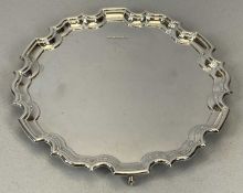 WAVY EDGE CIRCULAR SILVER SALVER on three scroll feet, 25cms diam., inscribed verso 'Anne and David,