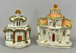 TWO LARGE FLOWER ENCRUSTED POTTERY COTTAGES Provenance: private collection Denbighshire