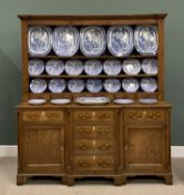 NORTH WALES OAK BREAKFRONT DRESSER CIRCA 1850, having wide backboards to a three-shelf rack and a