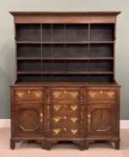 NORTH WALES ANGLESEY OAK BREAKFRONT DRESSER, having a wide boarded back three-shelf rack over a base