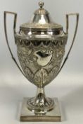 IMPRESSIVE GEORGE III SILVER LIDDED TWO-HANDLED HORSE RACING TROPHY, the main body chased with a
