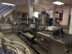 Hartness Model 825 Drop packer with Hamrick Manufacturing Service Lane Orienter