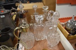 A fine selection of early 20th century clear cut glass decanters, and two claret jugs