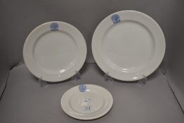 Three graded plates,'Royal Lancashire agricultural society' emblem to tops in blue on white ground.