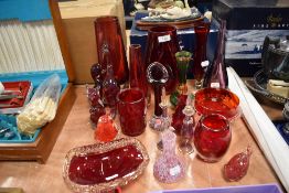 A mixed lot of glass, including heavy ruby art glass, paper weights, perfume bottles and similar.