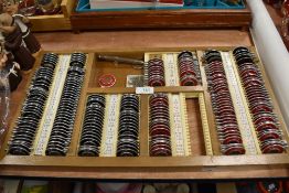 A wooden cased 'Rayner' optical lens box containing a huge assortment of lenses, grub screws and