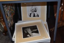 Four framed Marilyn Monroe prints.