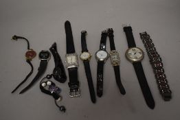 10 wrist watches all in black tones.