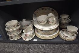A part Royal Doulton 'Camelot' dinner service having autumnal toned leaf design on white ground,
