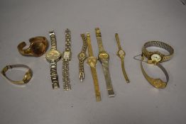 10 wrist watches all in gold tones.