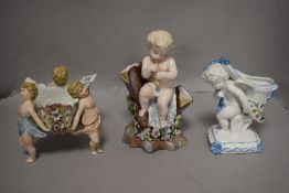 Three antique German porcelain cherub design pieces including table centre, spoon warmer and a vase
