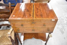 A Georgian vanity wash stand having fold out top with three drawers and two false fronted drawers on