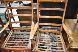A pair of vintage teak chair frames by Parker Knoll, very stylised