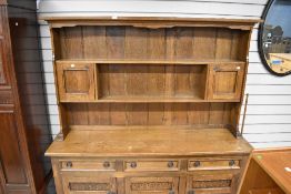 A 20th century oak framed dresser base and plate rack back