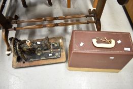 An antique Frister and Rossmann hand cranked sewing machine
