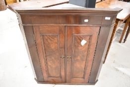 A 19th Century mahogany corner wall cupboard