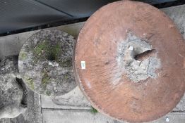 Two traditional grindstone wheels