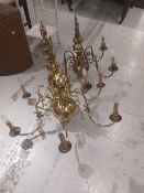 Two large brass Dutch style chandelier type light fittings, with double eagle head surmounts and
