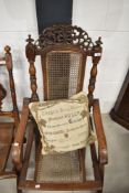 A Victorian beech frame folding campaign style chair having canework seat and back