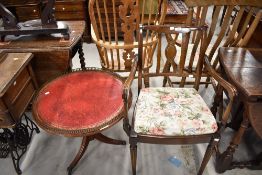 A reproduction Regency carver chair and side table having leather top and brass gallery
