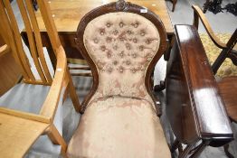 A Victorian nursing chair having shaped back