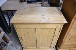 A vintage stripped pine pot cupboard
