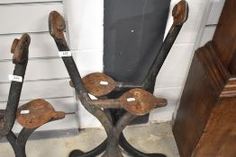 A pair of Victorian cast iron bench ends