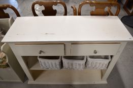 A modern painted pine dresser having double drawers and shelves below