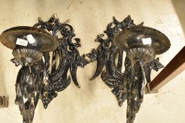 A pair of painted wrought iron candle sconces of large propotions, height approx. 48cm