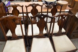A set of six early 20th Century stained frame vase back dining chairs
