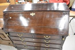 A 19th Century dark stained bureau in the Georgian style, width approx. 113cm