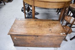 An antique bedding box having oak plank sides and top