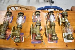 A set of five carriage style brass wall light fittings with glass shades (one af)