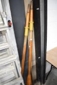 A board of wooden boat oars