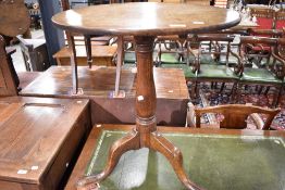 A 19th Century oak tripod table, having circular top, diameter approx. 62cm