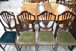 A set of four early 20th Cntury mahogany shield back dining chairs