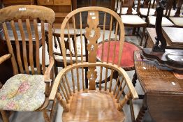 A traditional stripped Windsor armchair