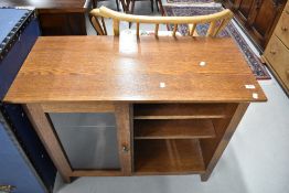 A modern oak bookshelf with glazed section