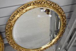 A modern composite framed circular mirror