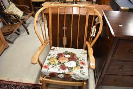 A traditional spindle back rocking chair having turned frame