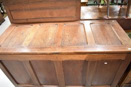 A traditional kist of large proportions having four panelled top and front, approx. Width 156cm
