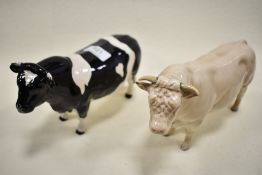 Two Beswick figure studies of bulls including Charolais 2463A and Freisian 1439A