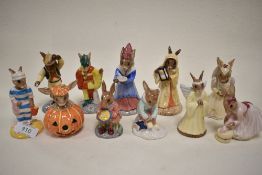 Eleven Royal Doulton Bunnykins figure studies including Girl Skater, Sands of Time, Sundial,