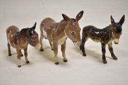 Three figure studies including Beswick Donkey 2267A, 1346B, a Goebel Donkey CE314