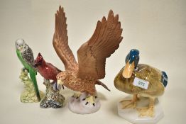 Four Beswick bird figures including Golden Eagle 2062 in matt, Green Budgie facing left 1216 AF,