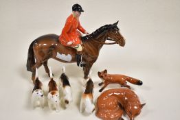 Seven Beswick figure studies including Huntsman no. 1501, four Beswick Fox Hounds, Fox no. 1440