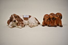 Two figure studies including Three puppies no. 917 and a Royal Doulton Spaniel and puppy DA174